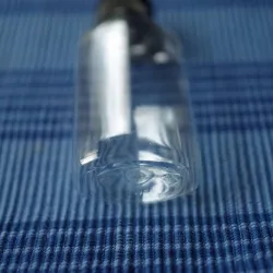 Butelka  50 ml PET z czarną nakrętką flip-top, owalna