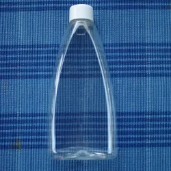 Butelka 250 ml PET z białą nakrętką z reduktorem, owalna